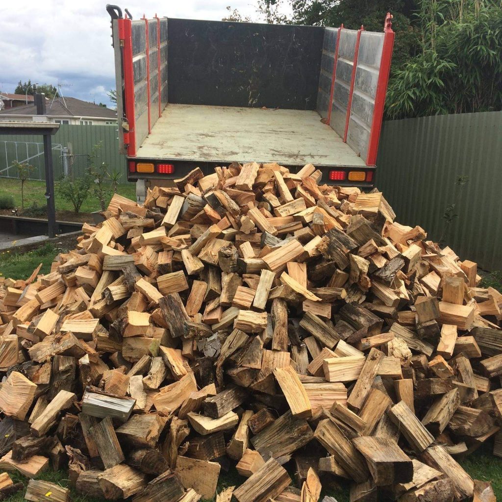 Split firewood delivered with tipping truck